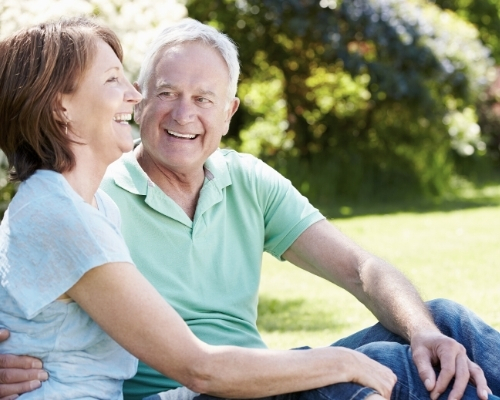 senior couple outside smiling